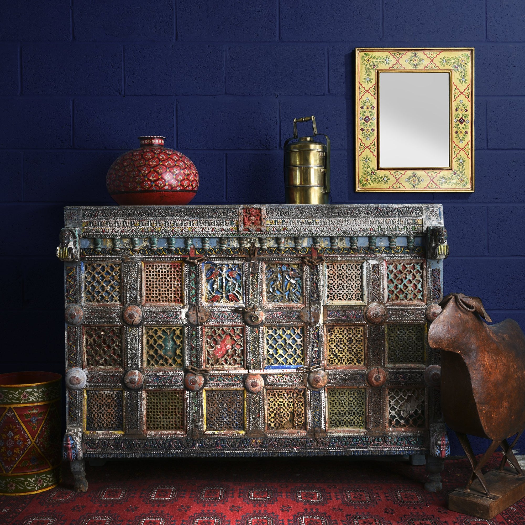 A dramatic painted Indian Damchiya dowry chest  with beautifully painted Indian mirrors and lota.