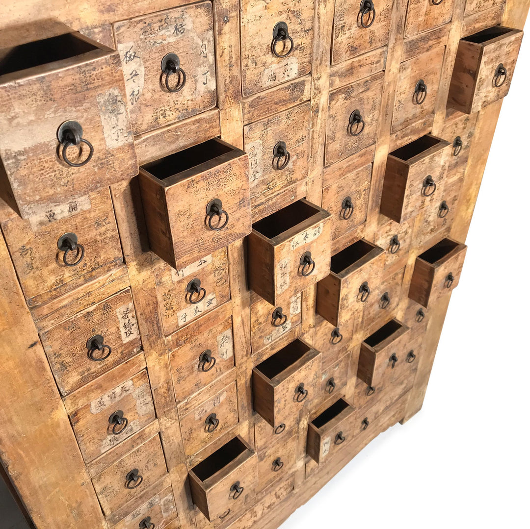 Open Drawers of a Chinese apothacary chest of drawers, also known as a chinese medicine cabinet. This cabinet is yellow
