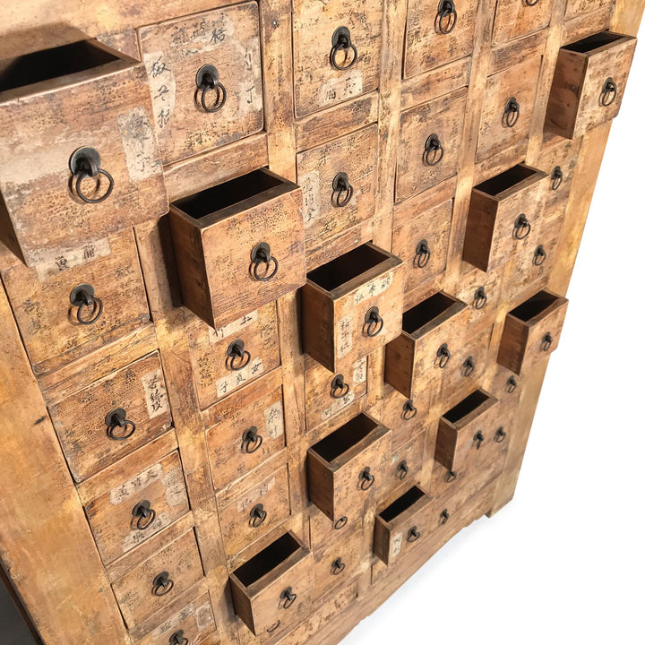 Open Drawers of a Chinese apothacary chest of drawers, also known as a chinese medicine cabinet. This cabinet is yellow