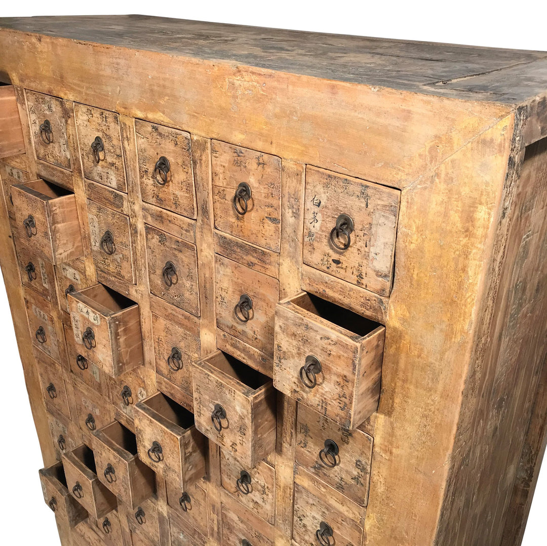 Open Drawers of a Chinese apothacary chest of drawers, also known as a chinese medicine cabinet. This cabinet is yellow