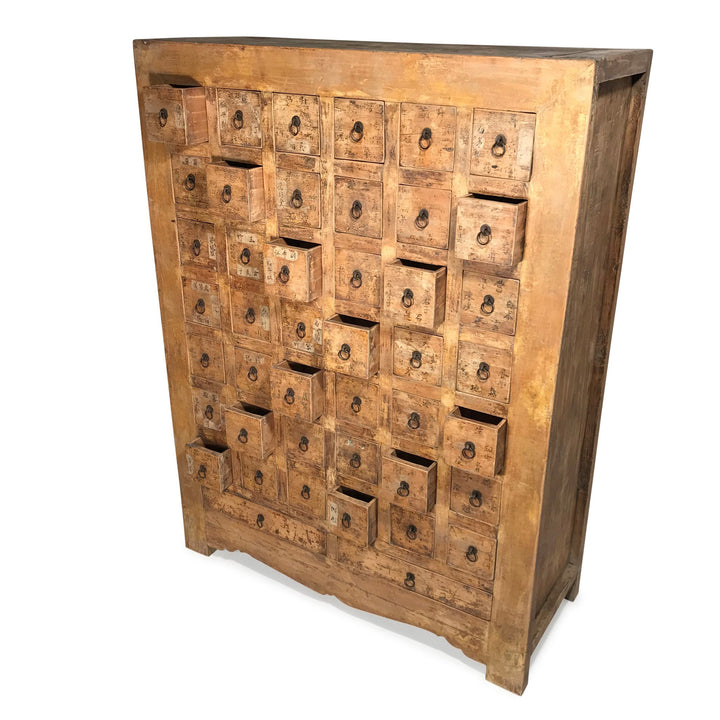 Open Drawers of a Chinese apothacary chest of drawers, also known as a chinese medicine cabinet. This cabinet is yellow